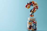 Colorful pills and capsules forming a question mark above a glass jar on a light blue background, symbolizing medical uncertainty.