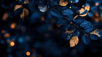 Glowing autumn leaves in moonlight with golden bokeh lights creating magical evening atmosphere, dark blue background with copper highlights on foliage.