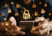 Glowing padlock icons floating above smartphone screen with hands holding device, representing digital security and data protection in mobile technology.