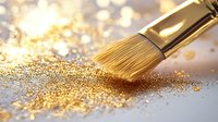 Makeup brush sweeping through scattered gold glitter powder on light surface with bokeh effect background creates luxurious cosmetic composition.