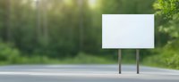 Empty white billboard on rural road with green forest background and sunlight. Mockup for outdoor advertising and marketing campaigns in nature setting.