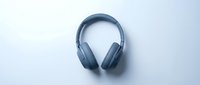 Blue wireless headphones isolated on white background, ready for design use in tech marketing, product mockups, and audio equipment promotional materials.