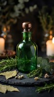 Green glass bottle with copper stopper surrounded by fresh herbs and spices on dark slate surface with warm candlelight creating atmospheric spa wellness mood.