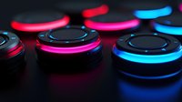 Glowing smart buttons with red, pink and blue neon lights on black surface create futuristic gaming or technology control panel atmosphere.
