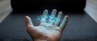 Open hand displaying glowing digital hologram with data visualization and network connections, representing technology, innovation, and future digital transformation for business solutions.