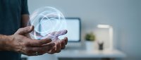 Digital healthcare technology concept with glowing heart hologram floating above cupped hands in modern medical office environment for telemedicine applications.