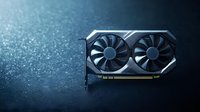 Modern graphics card with dual cooling fans on dark reflective surface with bokeh light effects in background, showcasing gaming hardware technology.