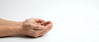 Open cupped hands gesture on white background showing palm up position for receiving or offering concept in business and communication.