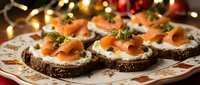 Festive smoked salmon appetizers on dark bread with cream cheese and dill garnish, perfect for holiday entertaining and Christmas party catering menus.