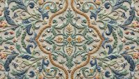 Ornate vintage floral seamless pattern with decorative scrollwork and botanical motifs in muted colors, tiles perfectly for wallpaper and textile designs.