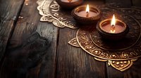 Burning candles in decorative holders on ornate golden mandala plate against rustic wooden background, creating warm atmospheric glow.