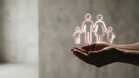 Glowing family protection concept with neon pink figures floating above cupped hands against concrete wall background for insurance and care themes.
