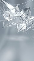 Futuristic silver crystal geometric shapes with sharp edges and reflective surfaces on a sleek gray background for modern design.