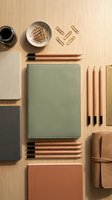 Flat lay of organized office supplies and stationery in earth tones on wooden background for workspace design and productivity concepts.