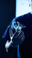 Hand holding glowing stethoscope hologram with blue light effects, representing digital healthcare technology and medical innovation for telemedicine applications.
