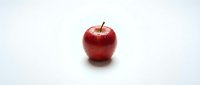 Fresh red apple with stem isolated on white background, suitable for food, nutrition, health and wellness design projects.