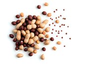 Mixed nuts and chocolate candies scattered on white background, overhead view of peanuts and round chocolate pieces creating dynamic composition. Isolated food photography.