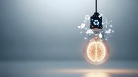 Glowing light bulb with brain filament surrounded by digital icons representing innovation, creativity, artificial intelligence and technology concepts.
