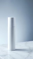 White cosmetic spray bottle on marble surface with soft gray background for skincare and beauty product packaging design.
