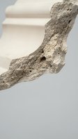 Natural volcanic pumice stone with porous texture on neutral background for spa wellness skincare and exfoliation treatments in minimalist setting.