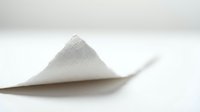 Pile of white powder on neutral surface, suitable for pharmaceutical, cosmetic, chemical, or culinary product photography and marketing materials.