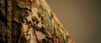 Vintage tapestry with intricate floral embroidery showcasing traditional needlework craftsmanship and textile artistry for home decor and interior design projects.