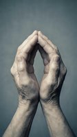 Elderly hands forming protective shelter gesture against gray background symbolizing care, security, support and guardianship in healthcare concepts.
