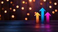 Glowing colorful arrows pointing upward against dark background with bokeh lights, symbolizing growth, success and progress in business visualization.
