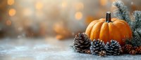 Orange pumpkin with pine cones and fir branches on rustic background with bokeh lights and snow, seasonal autumn to winter holiday transition decor.