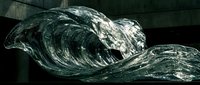 Dramatic ocean waves crashing with powerful water splashes and foam against dark stormy seascape for marine and nautical themed designs.