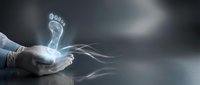 Hands holding glowing digital footprint hologram with flowing light trails against dark background, representing technology, data tracking, and digital innovation.