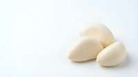 Peeled garlic cloves isolated on white background, ready for cooking, culinary design, recipe illustrations, and food packaging projects.