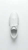 White leather sneaker top view on light background, minimalist style casual footwear with laces, clean modern design for fashion and lifestyle concepts.