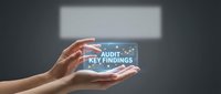 Professional hands presenting glowing digital audit key findings interface with modern holographic display for business analysis and financial reporting.