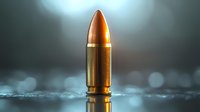 Single golden bullet standing upright on reflective surface with dramatic moody lighting and bokeh effect in background, symbolizing power and conflict.