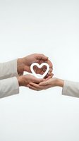 Hands protecting white heart symbol representing love, care, support and compassion in healthcare, charity and wellness concepts on clean background.