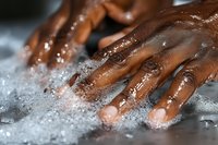 Close-up of hands washing with soap and water, showing proper hygiene and cleanliness routine for health and wellness in daily life.