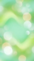 Soft blurred bokeh background with mint green, lime, and cream tones creating an abstract, dreamy atmosphere. Use for wellness, spa, nature, or lifestyle design projects.