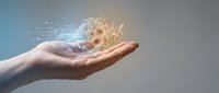 Human hand holding glowing golden brain with digital network connections and light effects representing artificial intelligence and innovation.