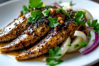 Grilled chicken breast seasoned with black pepper and herbs, served with fresh parsley garnish and red onion rings on white plate, close up view of juicy meat.