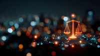 Glowing scales of justice symbol against blurred city lights background, representing law, legal services, and justice system in modern urban setting.