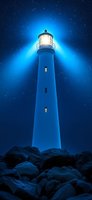 Majestic lighthouse tower illuminated against starry night sky, casting bright beams through dark blue atmosphere, standing tall among rocky coastal foundation.