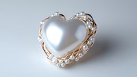 Elegant white pearl heart brooch with delicate gold wire wrapping and small pearl accents on light gray background, romantic jewelry piece for wedding accessories.