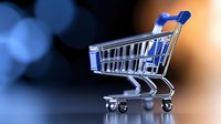 Empty shopping cart on dark background with blue bokeh lights, retail and commerce concept for online stores and e-commerce business.
