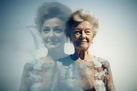Senior Caucasian woman in white floral dress with double exposure effect showing younger self, representing aging, memories and life journey concept.