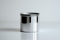 Empty metal tin can with reflective chrome surface on white background with soft shadow, isolated product photography for packaging and branding mockup.