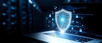 Cybersecurity shield protection concept with glowing security icons emerging from laptop screen against dark digital background for business technology.