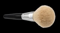 Makeup brush with natural bristles, black handle, and silver ferrule isolated on transparent background. Ready for clipart, design elements, print-on-demand, sublimation, and digital crafts.