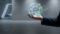 Businessman in dark suit holding glowing digital globe with network connections and data visualization, representing global technology, innovation, and worldwide business connectivity.