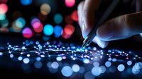 Hand drawing glowing network connections on dark surface with colorful bokeh lights in background, representing digital transformation and technological innovation.